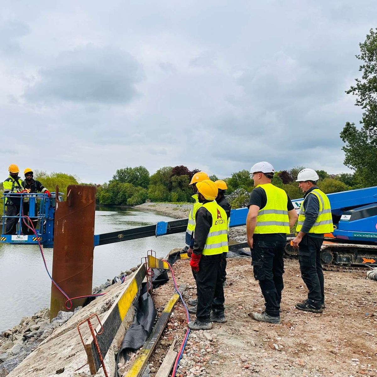 Arcon crew on a riverside construction site in Belgium