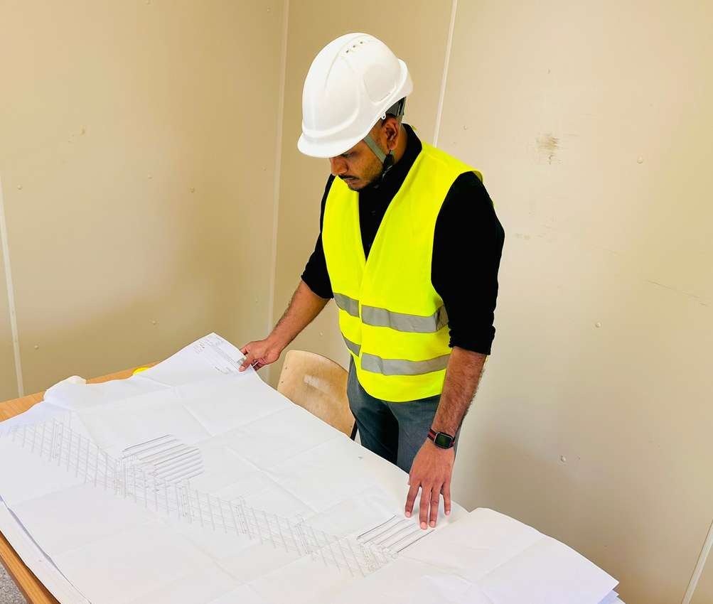 Arcon engineer reviewing construction drawings