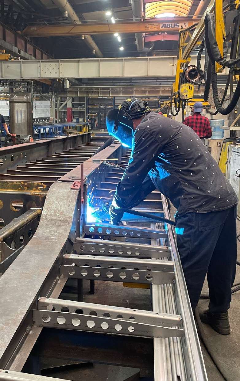 Welder working on a steel frame