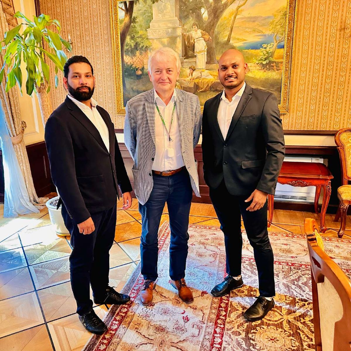 Muneer Shaikh and a colleague with a European business partner
