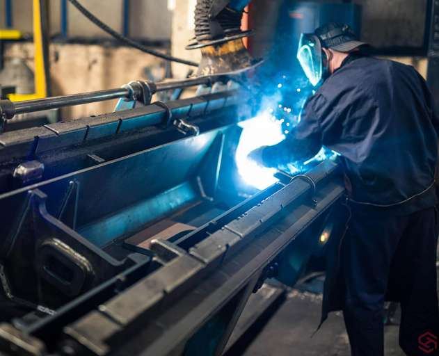 Welder at work on a steel component